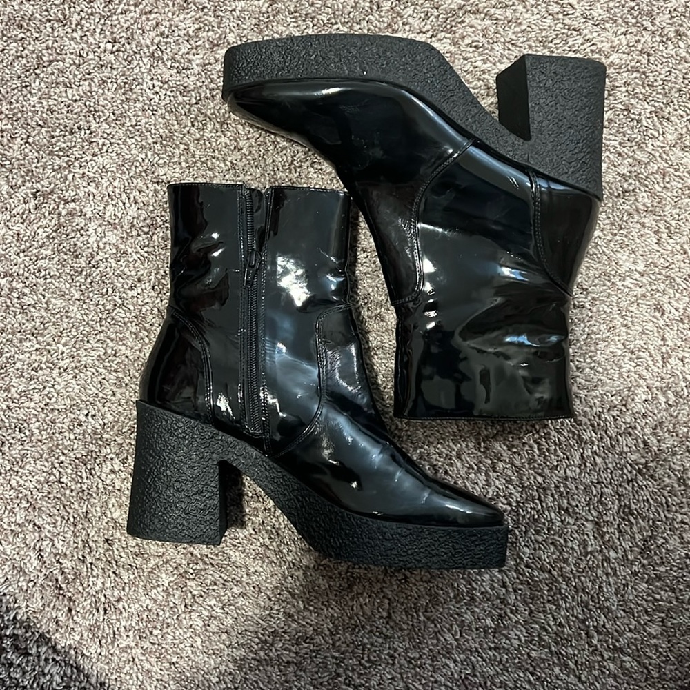 Black faux leather booties.